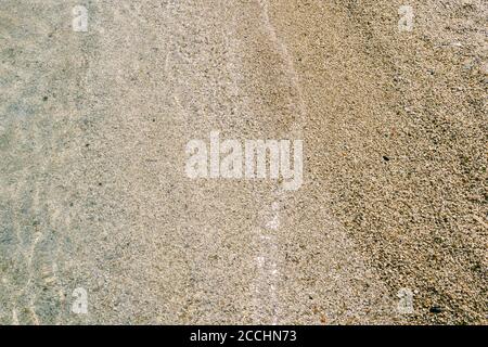 Sea beach with white coarse sand. Stock Photo