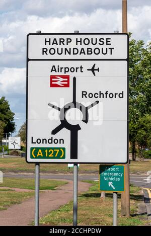 Harp House Roundabout traffic road sign. London Southend Airport, railway station, Rochford, London A127 arterial road. Destinations. Stock Photo