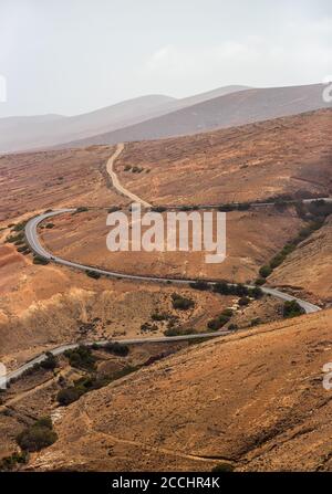 View on the mountain road from Mirador (viewpoint) de Morro Velosa. Fuerteventura. Canary Island. Spain. Stock Photo