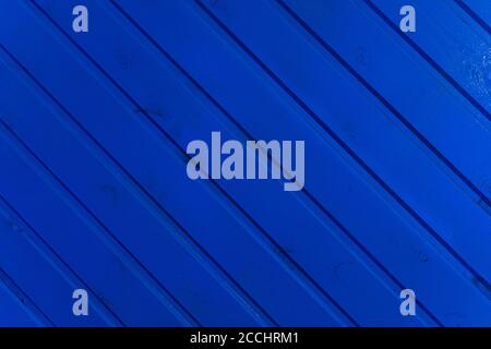 the surface of the wooden slats is painted blue Stock Photo