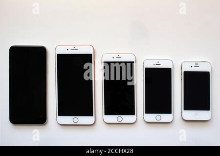 Calgary, Alberta, Canada. Aug 22, 2020. Several iPhone screens from view on a white background. Stock Photo