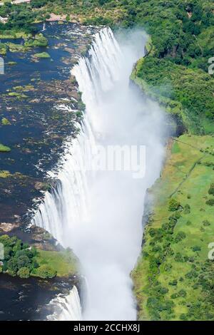 Aerial view of Victoria Falls located Zimbabwe and Zambia border. Zambezi River waterfall in Africa. Helicopter view of the fall.