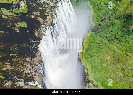 Aerial view of Victoria Falls located Zimbabwe and Zambia border. Zambezi River waterfall in Africa. Helicopter view of the fall.
