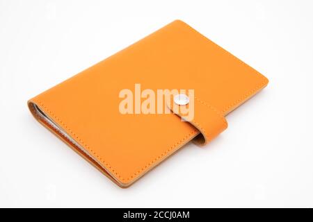 Orange notebook isolated on white background Stock Photo