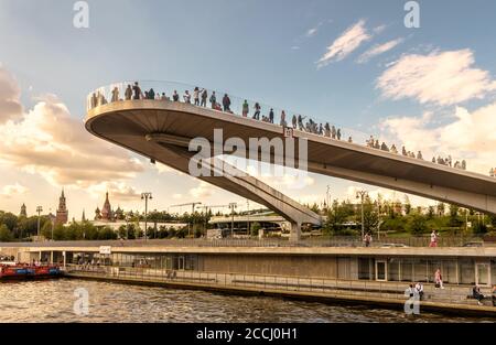 Moscow - Aug 21, 2020: Floating bridge above Moskva River in Zaryadye Park near Moscow Kremlin, Russia. Zaryadye is modern tourist attraction of Mosco Stock Photo