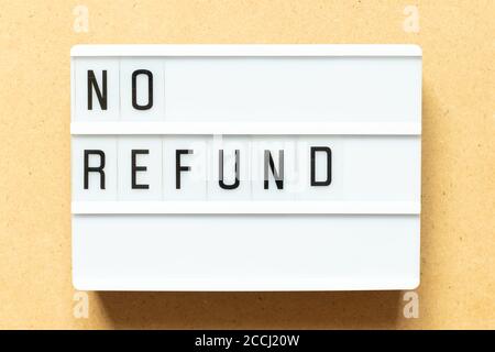 Lightbox with word no refund on wood background Stock Photo