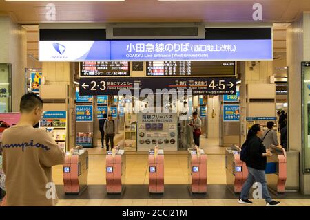Tokyo, Japan - May 4 2019 : Unidentified people walk in front of Odakyu line entrance at Shinjuku station. This line can lead to Hakone that is the fa Stock Photo