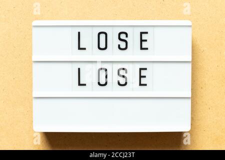 Lightbox with word lose lose on wood background Stock Photo