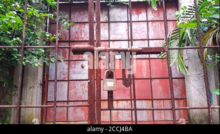 Closed Iron Gate with lock. Padlock on Iron Gate. Stock Photo
