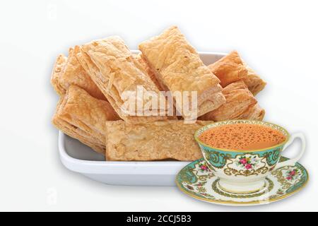 indian khari or kharee or salty Puff Pastry Snacks, with tea, Khari bread Rusk, Puff Pastry Snacks, fresh square shaped puff pastry biscuit snacks wit Stock Photo