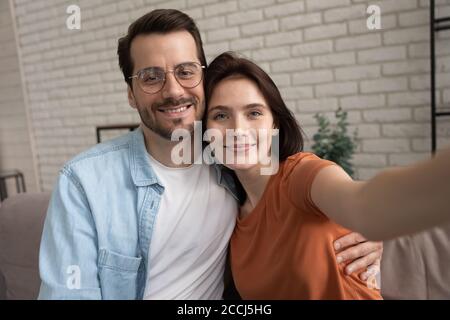 Happy young couple take selfie relaxing at home Stock Photo