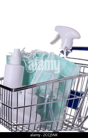 Shopping cart filled with different kinds of desinfectants on white background Stock Photo