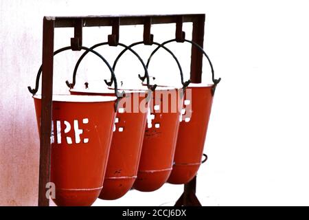 Fire Safety Sand Bucket hanging against white background