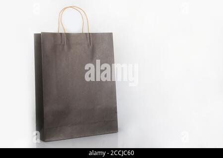 Brown packaging paper bag on a white background. Paper bags for shopping needs and merchandise packaging Stock Photo