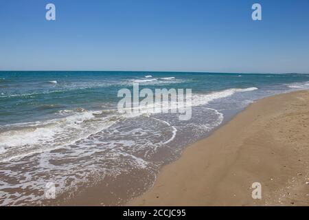 Beach view in summer ,sunny day in Calafell,Spain ,Mediterranean Sea.Empty beach no people.Travel destination.Holidays background. Stock Photo