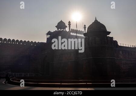 View of sun rays shining through the famous Red Fort monument in New Delhi, Contrasty image of Red Fort Stock Photo