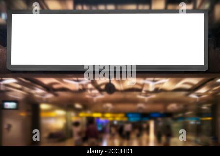 Airport advertising concept : Empty blank white screen advertising billboard frame hang in airport