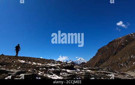 Hiking of a photographer near Rohtang Pass at 14000 ft. on Himalaya Stock Photo