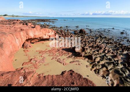 Scenic view of orange rocks at Smith Point in remote Cobourg Peninsula, Arnhem Land, Northern Territory, NT, Australia Stock Photo