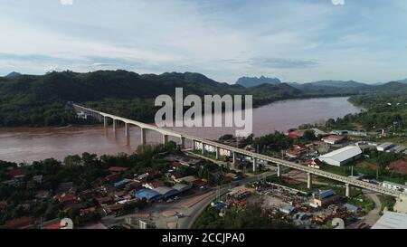 (200823) -- VIENTIANE, Aug. 23, 2020 (Xinhua) -- Aerial photo taken on July 17, 2020 shows the China-Laos Railway's Luang Prabang Mekong River Super Major Bridge in Laos.  The China-Laos Railway will run more than 400 km from Boten border gate in northern Laos, bordering China, to Vientiane with an operating speed of 160 km per hour. The project started in Dec. 2016 and is scheduled to be completed and open to traffic in December 2021. (Photo by Mei Zhengyou/Xinhua) Stock Photo