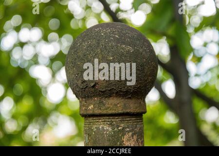 Stone fence posts round in the garden Stock Photo