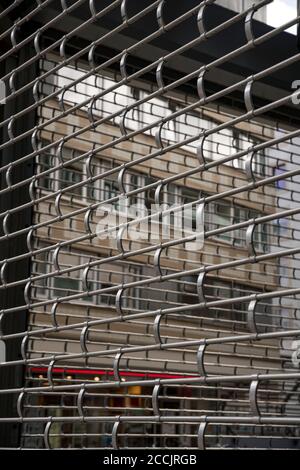 Grille in front of a shop for protection Stock Photo
