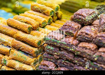 Various bright colored turkish delights sweets baklava lokum and dried fruits vegetables on market in Istanbul, Turkey. Stock Photo