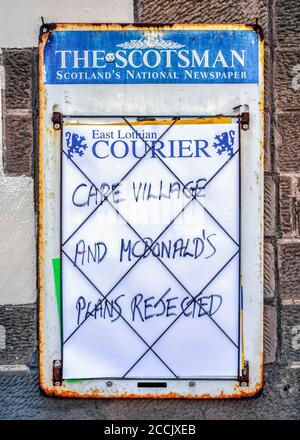 Newspaper billboard in North Berwick, East Lothian, Scotland, UK. Stock Photo