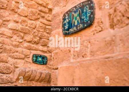 Tel Aviv-Yafo, Israel, December 25, 2017 : A sign with the name of the street in Hebrew - Lane of the sign of the zodiac  in on old city Yafo in Tel A Stock Photo