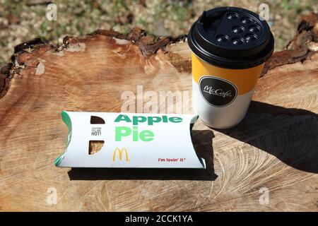 McDonald's Apple Pie and McCafe coffee cup outside, sunny day, 2020 Stock Photo