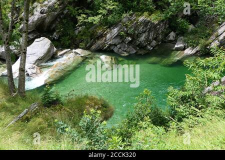 View of the scenic emerald green river in the valley Valle Verzasca near Locarno in Switzerland Stock Photo