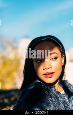 Beautiful African American woman looking away outdoors Stock Photo