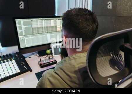 Dj producing music in his studio Stock Photo