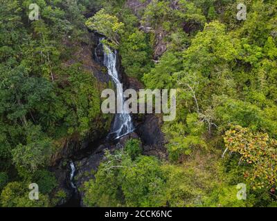 Myanmar, Mergui or Myeik Archipelago, Dome island, Waterfall in tropical forest, aerial view Stock Photo