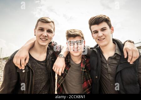 Portrait of smiling teenage friends Stock Photo