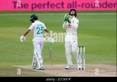 Pakistan's Fawad Alam reacts after being caught out by England's Jos Buttler during day three of the Third Test match at the Ageas Bowl, Southampton. Stock Photo