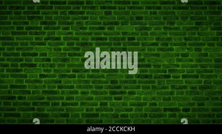 A panoramic view of an aged green brick wall texture with vignette. Stock Photo