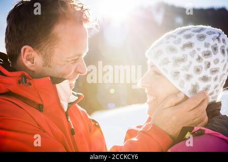 Happy affectionate couple in winter landscape, Achenkirch, Austria Stock Photo