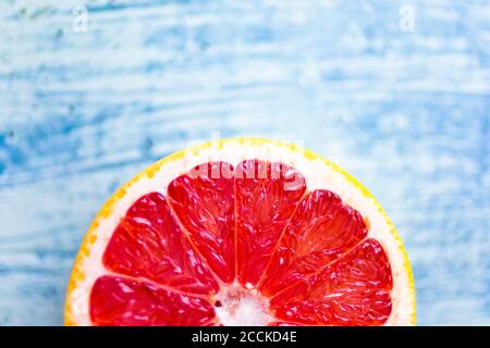 Fresh chopped grapefruit on wood Stock Photo