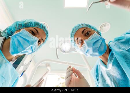 Doctor and nurse working in dentist's clinic Stock Photo