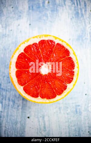 Fresh chopped grapefruit on wood Stock Photo