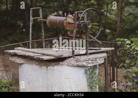 Old water fountain in a village in Romania. Selective focus Stock Photo