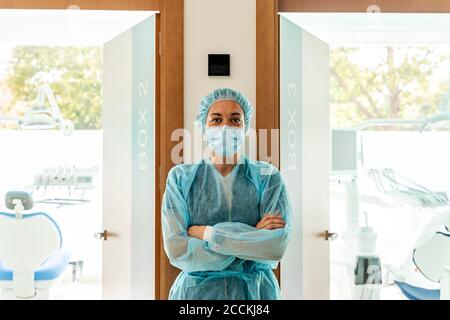 Female dentist standing in office Stock Photo