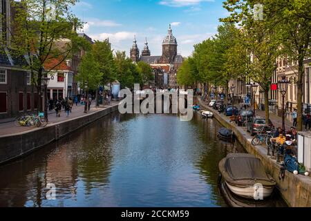 Netherlands, North Holland, Amsterdam, Binnenstad canal with Basilica of Saint Nicholas in background Stock Photo