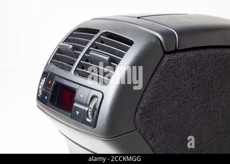 The spare part and interior element from the car are separate climate control and an ashtray for rear passengers on the central panel. on a white isol Stock Photo