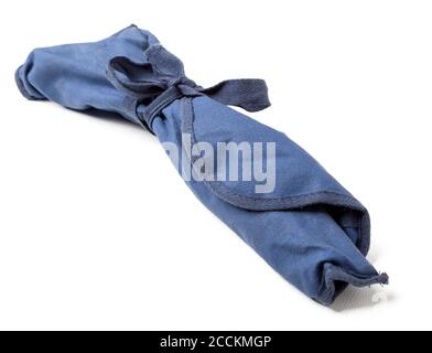 Blue rag pouch with knotted knot and surprise inside on white isolated background. Stock Photo