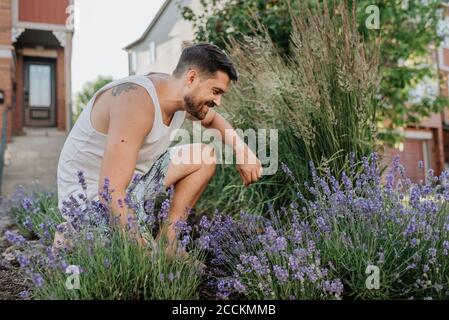 Man gardening in his front lawn Stock Photo