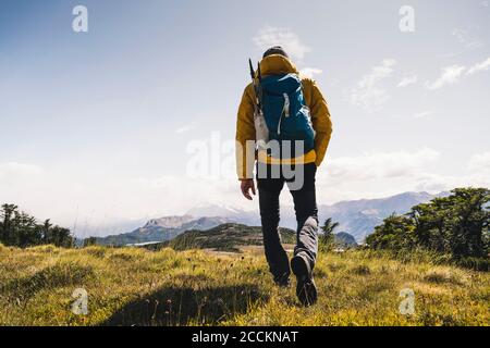 Man with backpack hiking on mountain at Patagonia, Argentina, South America Stock Photo