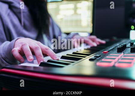 Dj producing music in his studio Stock Photo