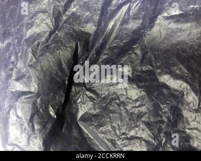 Cellophane plastic background texture packaging pattern shiny. Bag material industrial close up wrap